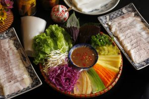 Sliced pork rolled with rice paper