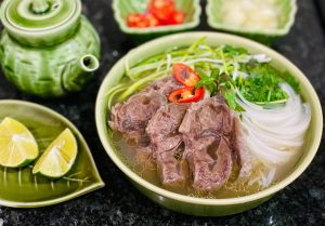 what to eat in Hanoi-pho bo ( beef noodle soup)