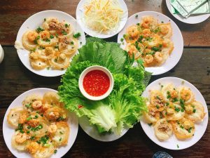 "banh khot" (mini savory pancakes topped with shrimp)